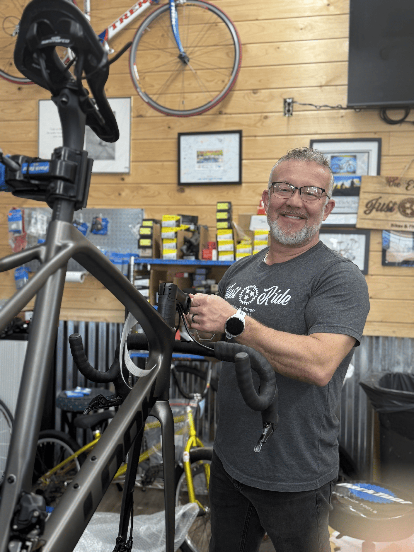 Brian Edwards, owner of Just Ride Bikes, working on a bike