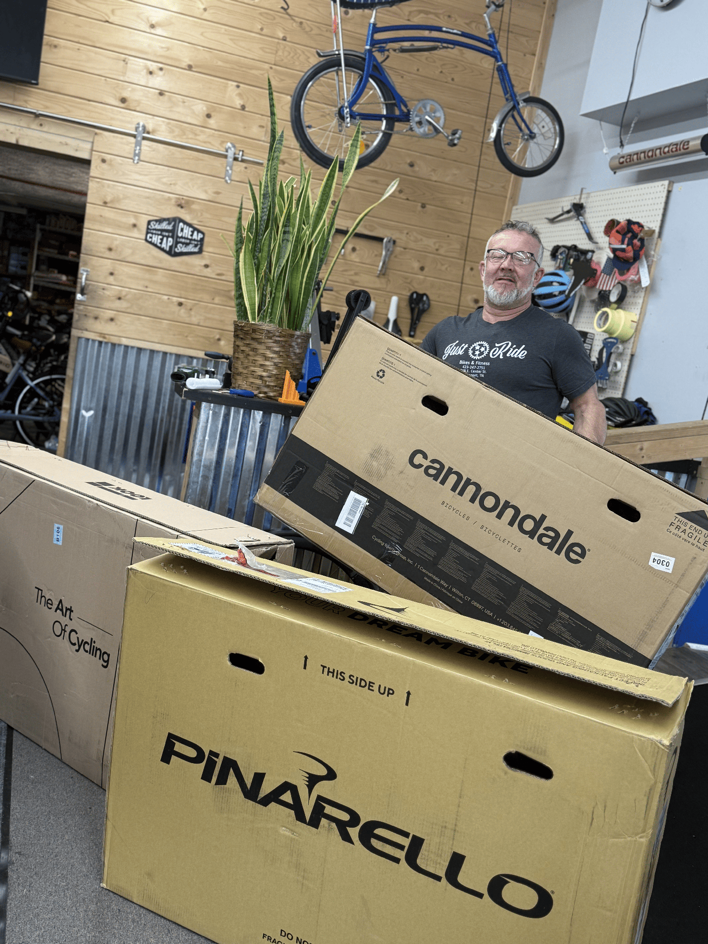Brian Edwards unpacking Cannondale and Pinarello bikes at Just Ride Bikes